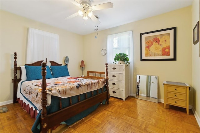 bedroom with baseboards and a ceiling fan