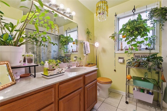 609 N Starrett Rd, Metairie, LA 70003 - bathroom with vanity, healthy amount of natural light, tile patterned floors, and a shower with curtain
