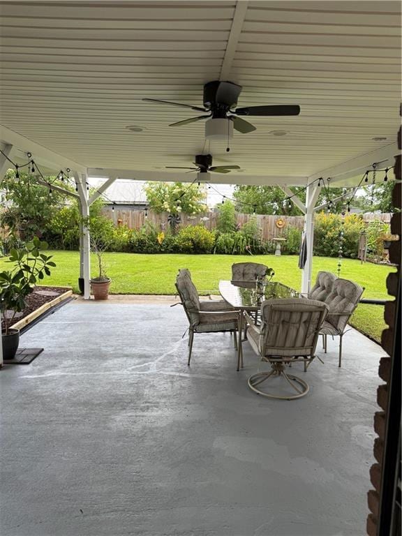 609 N Starrett Rd, Metairie, LA 70003 - fenced backyard with a patio and ceiling fan