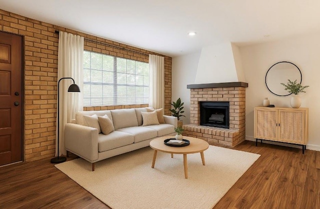 2305 Cleary Ave Unit 106, Metairie, LA 70001 - living area with dark wood-type flooring, a brick fireplace, recessed lighting, and baseboards