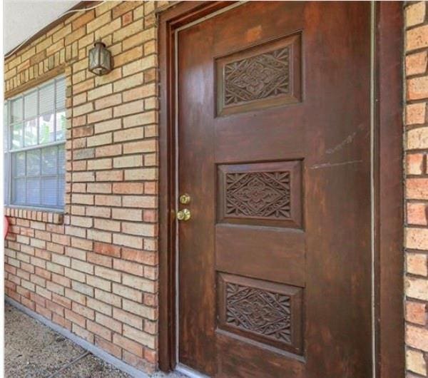 2305 Cleary Ave Unit 106, Metairie, LA 70001 - doorway to property featuring brick siding