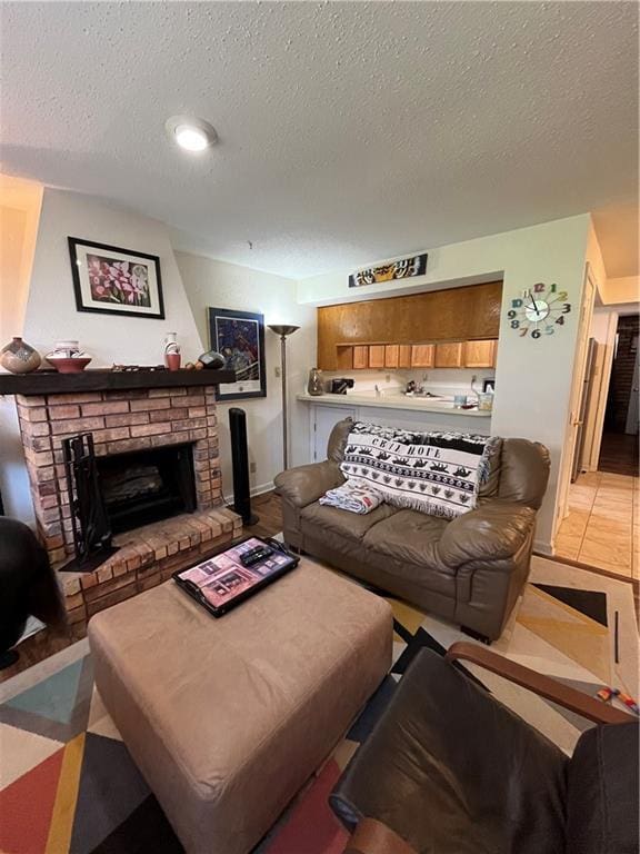2305 Cleary Ave Unit 106, Metairie, LA 70001 - living area with a textured ceiling, a fireplace, and baseboards