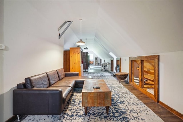 2334 Marengo St, New Orleans, LA 70115 - living area with vaulted ceiling, wood finished floors, and baseboards