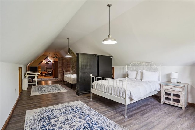 2334 Marengo St, New Orleans, LA 70115 - bedroom with baseboards, wood finished floors, and lofted ceiling