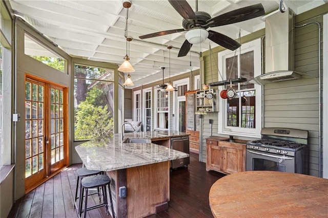 2334 Marengo St, New Orleans, LA 70115 - sunroom / solarium featuring french doors, coffered ceiling, plenty of natural light, ceiling fan, and beam ceiling