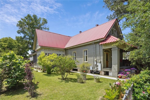 2334 Marengo St, New Orleans, LA 70115 - back of property featuring a yard and metal roof