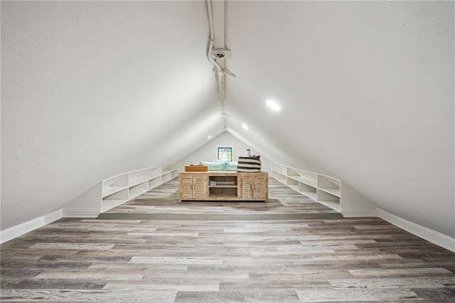 2334 Marengo St, New Orleans, LA 70115 - additional living space featuring baseboards, lofted ceiling, and wood finished floors