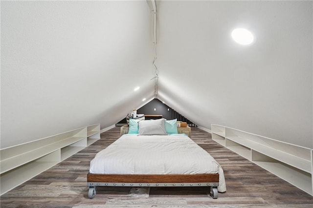 2334 Marengo St, New Orleans, LA 70115 - bedroom featuring lofted ceiling, wood finished floors, and rail lighting