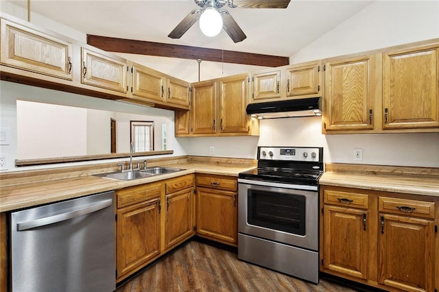 911 Forest Loop, Mandeville, LA 70471 - kitchen featuring stainless steel appliances, under cabinet range hood, light countertops, a sink, and dark wood-type flooring