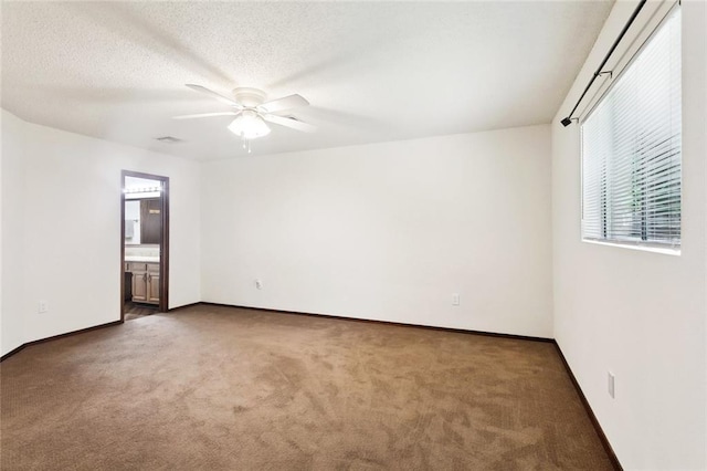 911 Forest Loop, Mandeville, LA 70471 - carpeted spare room with ceiling fan, baseboards, and a textured ceiling