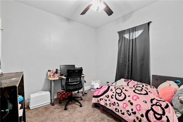 carpeted bedroom featuring ceiling fan and baseboards