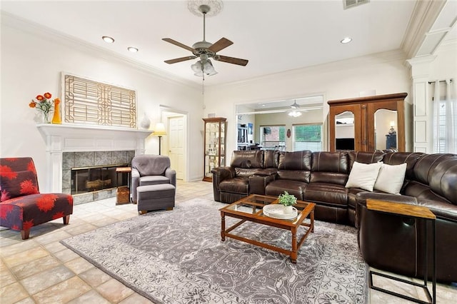 410 Doctor Gorman Dr, Belle Chasse, LA 70037 - living area with a ceiling fan, a tile fireplace, crown molding, and recessed lighting