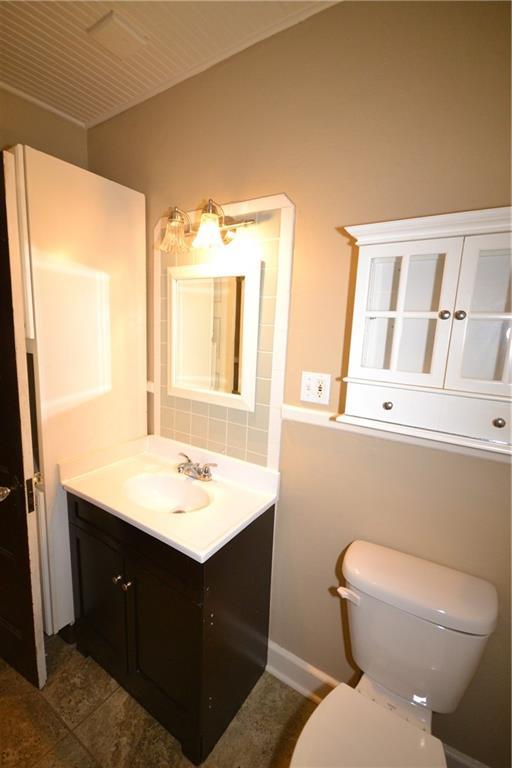 half bath with toilet and vanity
