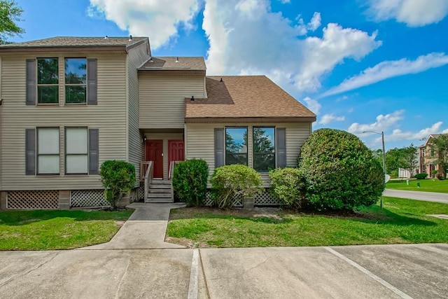 147 W Chamale Cv Unit 147, Slidell, LA 70460 - view of front of property with a front yard and roof with shingles