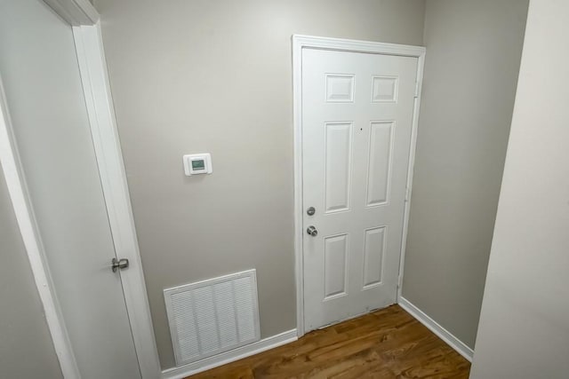 147 W Chamale Cv Unit 147, Slidell, LA 70460 - laundry area featuring wood finished floors and baseboards