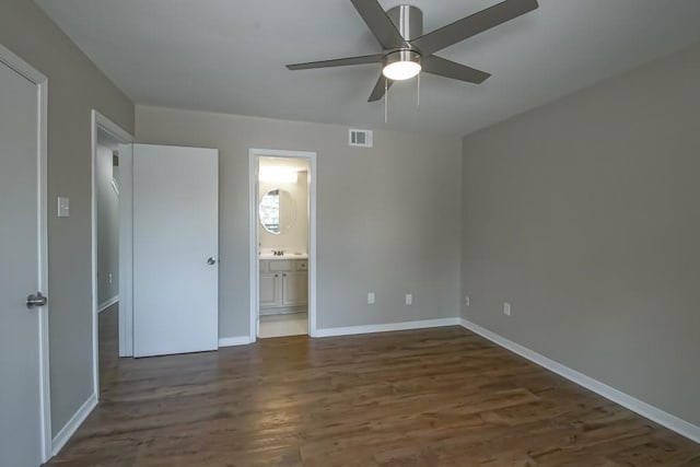 147 W Chamale Cv Unit 147, Slidell, LA 70460 - unfurnished bedroom with dark wood-style flooring, baseboards, and ensuite bath