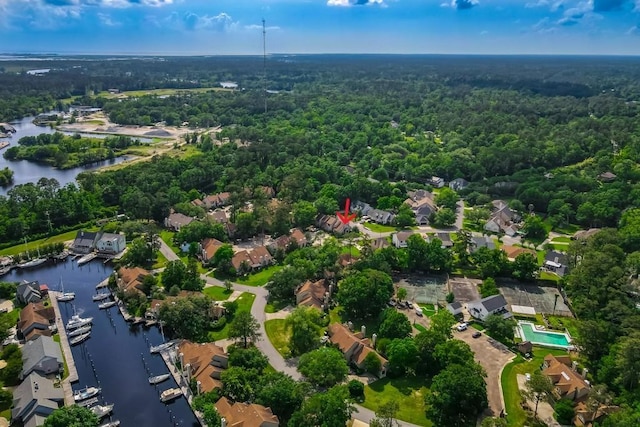 147 W Chamale Cv Unit 147, Slidell, LA 70460 - aerial overview of property's location with a forest, a large body of water, and nearby suburban area