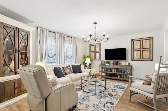 740 Heavens Dr Unit 8, Mandeville, LA 70471 - living room featuring a chandelier and light wood-style flooring