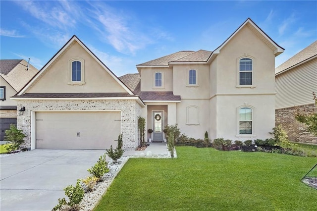 3957 Hook Island Ln, Slidell, LA 70461 - view of front facade with stucco siding, concrete driveway, a front lawn, a garage, and roof with shingles