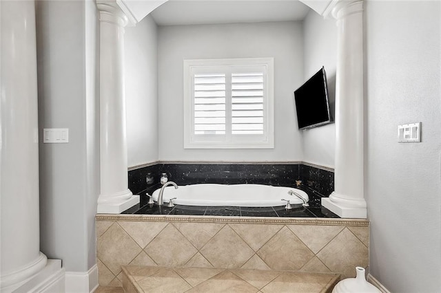 2283 Sunset Blvd, Slidell, LA 70461 - full bathroom featuring decorative columns, a garden tub, and toilet