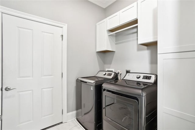 2283 Sunset Blvd, Slidell, LA 70461 - washroom with separate washer and dryer, cabinet space, light marble finish floors, baseboards, and crown molding