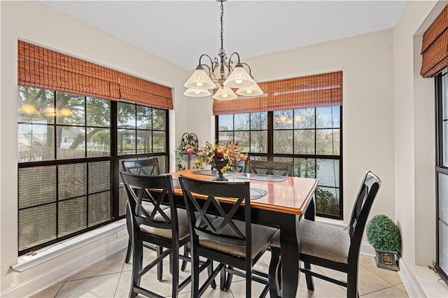 106 Eydie Ln, Slidell, LA 70458 - dining room with light tile patterned floors and a chandelier