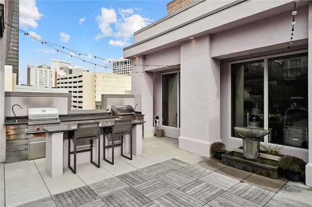 700 Magazine St Unit 513, New Orleans, LA 70130 - view of patio / terrace with a view of city and an outdoor bar