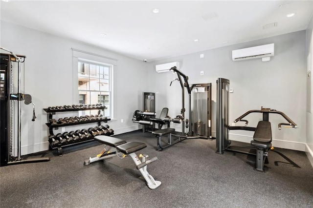 700 Magazine St Unit 513, New Orleans, LA 70130 - exercise room with a wall unit AC, baseboards, and recessed lighting