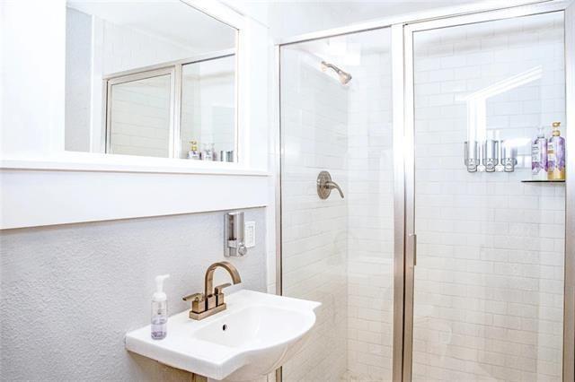 4226 S Carrollton Ave, New Orleans, LA 70119 - full bath with a shower stall and a sink