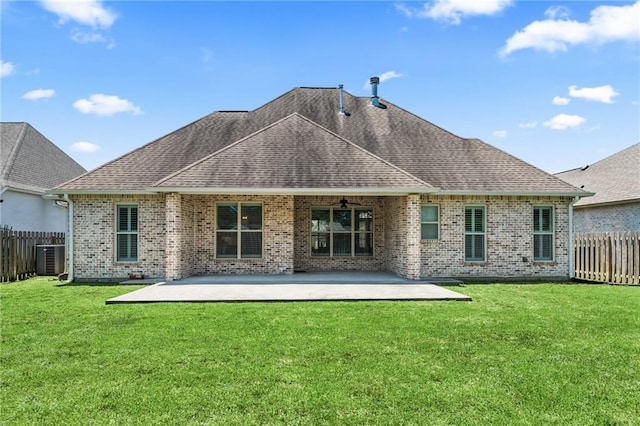 2021 Cypress Bend Dr, Madisonville, LA 70447 - rear view of property featuring roof with shingles, ceiling fan, a patio area, and brick siding