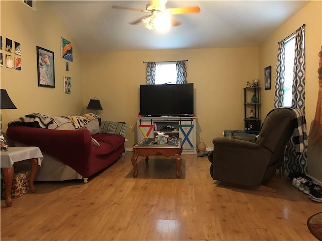 living area featuring ceiling fan and wood finished floors