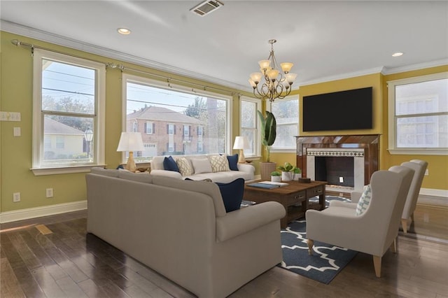 3630 Octavia St, New Orleans, LA 70125 - living area with crown molding, baseboards, a chandelier, dark wood-type flooring, and recessed lighting