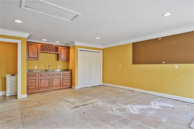 3630 Octavia St, New Orleans, LA 70125 - kitchen with baseboards, crown molding, recessed lighting, brown cabinets, and a sink