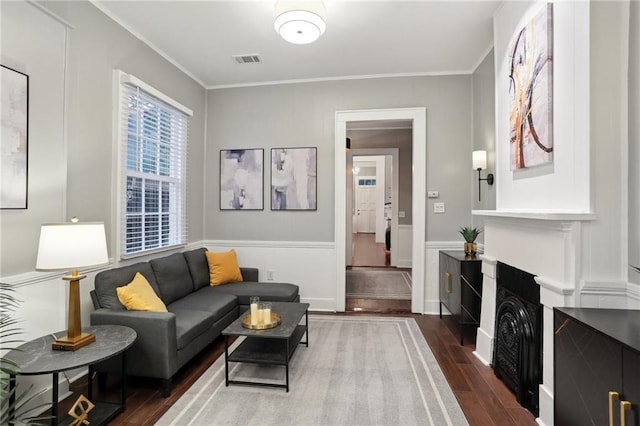 724 Port St, New Orleans, LA 70117 - living room with dark wood-type flooring and crown molding