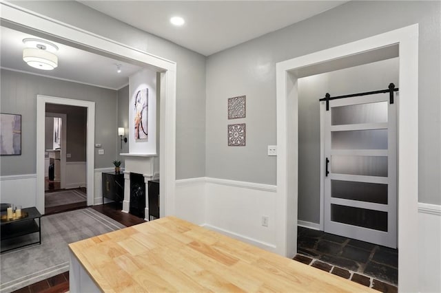 724 Port St, New Orleans, LA 70117 - hall with a barn door and wainscoting