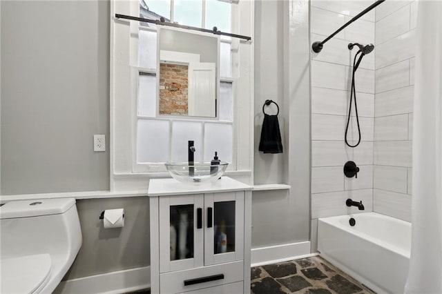 724 Port St, New Orleans, LA 70117 - full bath with toilet, tub / shower combination, vanity, and baseboards