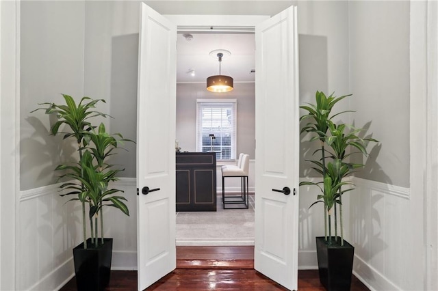 724 Port St, New Orleans, LA 70117 - corridor with dark wood finished floors and wainscoting