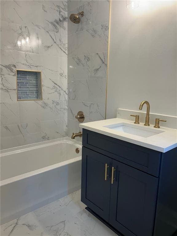 full bath featuring tub / shower combination, marble finish floors, and vanity