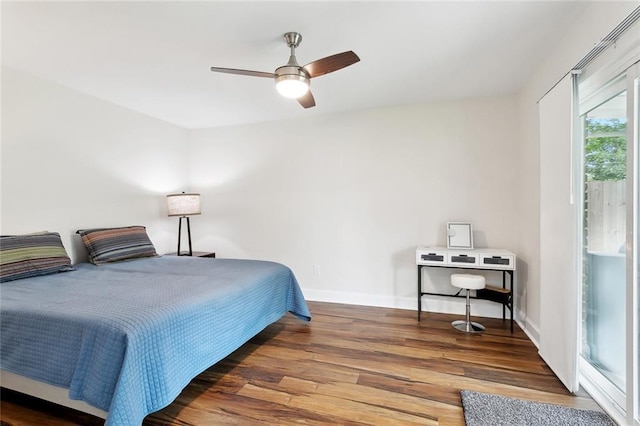 bedroom with wood finished floors, baseboards, and a ceiling fan