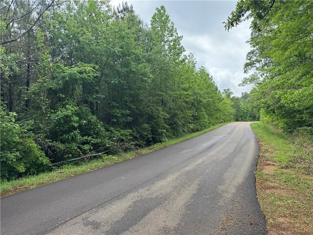 2048 Ashley Rd, Hazlehurst, MS 39083 - view of asphalt street featuring a wooded view