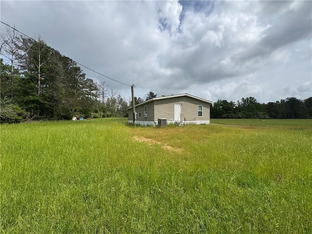 2048 Ashley Rd, Hazlehurst, MS 39083 - view of yard featuring central AC unit