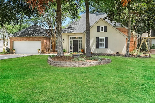 view of front facade featuring an attached garage, driveway, a front yard, a shingled roof, and stucco siding