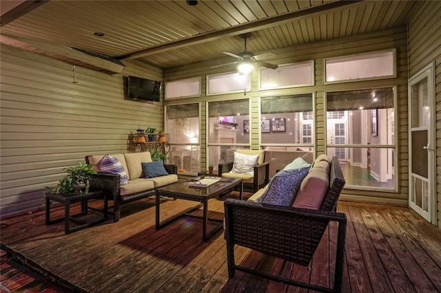 sunroom / solarium featuring an outdoor hangout area and a ceiling fan