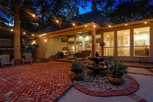 back of house with a patio area and an outdoor hangout area