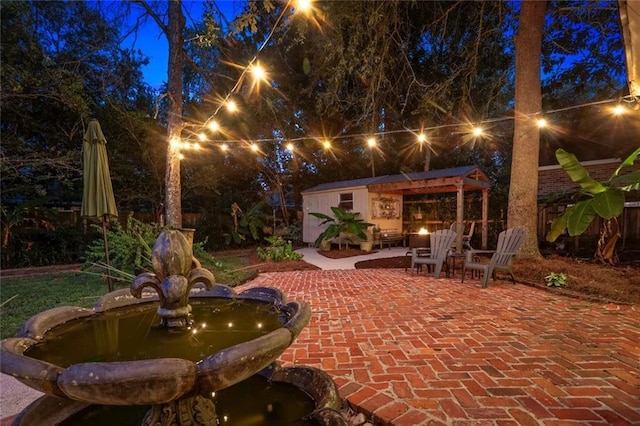 patio at night with an outdoor structure