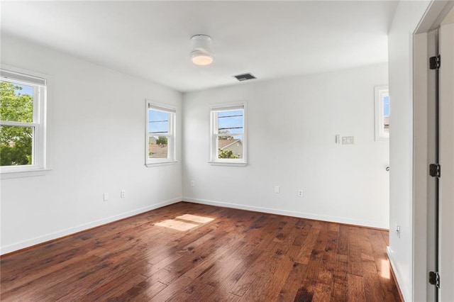 6415 Marshal Foch St, New Orleans, LA 70124 - unfurnished room with plenty of natural light, wood finished floors, and baseboards