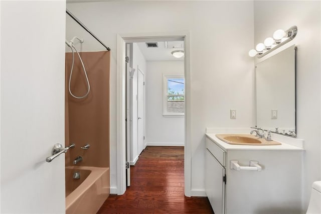 6415 Marshal Foch St, New Orleans, LA 70124 - bathroom with wood finished floors, vanity, bathtub / shower combination, and baseboards