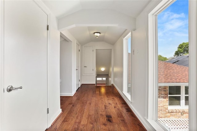 6415 Marshal Foch St, New Orleans, LA 70124 - hall featuring vaulted ceiling, dark wood-style floors, and baseboards