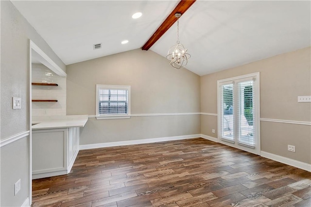 unfurnished dining area with plenty of natural light, dark wood-type flooring, a chandelier, and recessed lighting