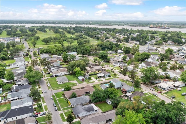 view of property location featuring nearby suburban area and a nearby body of water